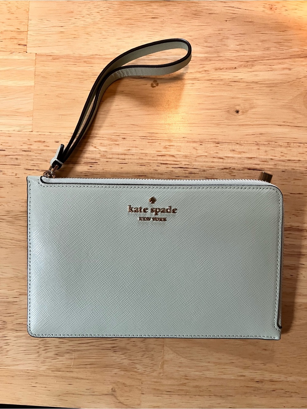 kate spade mint green wristlet clutch with gold logo